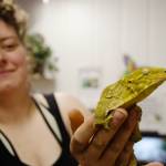 Taylor Howerton of Port Townsend holds up a New Caledonian giant gecko that belongs to her roommate. The gecko is one of 15 reptiles Howerton and her roommate are showing at this years Jefferson County Fair, which runs from Friday through Sunday. (Christy Carley/Peninsula Daily News)